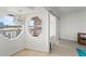 Hallway with decorative chandelier and a water view at 20019 Gulf Blvd # 1, Indian Shores, FL 33785