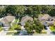 Aerial view of a beautiful home nestled among lush trees and well-manicured lawns in a desirable neighborhood at 203 Montara Dr, Seffner, FL 33584