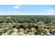 Residential aerial view of a home with mature trees in a suburban neighborhood at 203 Montara Dr, Seffner, FL 33584