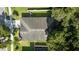 Aerial view of the home showcasing the roof and mature trees surrounding the property at 203 Montara Dr, Seffner, FL 33584