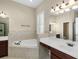 Bathroom features dual sinks, garden tub, and separate shower at 203 Montara Dr, Seffner, FL 33584
