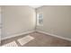Neutral bedroom with carpet and a bright window at 203 Montara Dr, Seffner, FL 33584