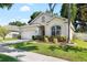 Charming single-story home with a manicured lawn, a two-car garage, and a welcoming entrance at 203 Montara Dr, Seffner, FL 33584