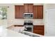 This kitchen features stainless steel appliances, plentiful storage, and sleek countertops at 203 Montara Dr, Seffner, FL 33584