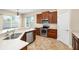 Well-lit kitchen with stainless steel appliances, tile flooring, and ample counter space at 203 Montara Dr, Seffner, FL 33584