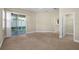 Spacious living room with sliding glass doors to the outside patio for relaxing and entertaining at 203 Montara Dr, Seffner, FL 33584