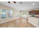 Bright and airy living area with plentiful windows and seamless flow into the kitchen at 203 Montara Dr, Seffner, FL 33584