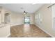Open floor plan living space with sliding glass doors and multiple windows for natural light at 203 Montara Dr, Seffner, FL 33584