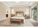 Beautifully decorated bedroom features a wooden accent wall, a light beige rug, and plenty of natural light at 203 Montara Dr, Seffner, FL 33584