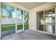 Screened porch provides an outdoor space with views of the grassy backyard at 203 Montara Dr, Seffner, FL 33584