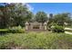 Entrance sign for the Sagamore Trace community surrounded by lush green foliage and trees at 203 Montara Dr, Seffner, FL 33584