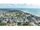 Breathtaking aerial view of beachfront homes near the ocean with beautiful beaches and canals at 215 18Th Ave, Indian Rocks Beach, FL 33785