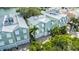 Gorgeous waterfront home with a metal roof, white shutters, and a two-car garage at 215 18Th Ave, Indian Rocks Beach, FL 33785