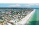 Expansive aerial shot of canal-front homes near a sandy beach with stunning coastline at 215 18Th Ave, Indian Rocks Beach, FL 33785