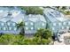 Beautiful waterfront home featuring a two-car garage and tropical landscaping at 215 18Th Ave, Indian Rocks Beach, FL 33785