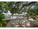 Picturesque backyard dock with serene waterfront views and lush foliage creating a tranquil outdoor space at 215 18Th Ave, Indian Rocks Beach, FL 33785