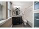 Bathroom with dark cabinets, modern fixtures, shower/tub combo and a large window for natural light at 215 18Th Ave, Indian Rocks Beach, FL 33785