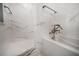 Beautiful bathroom showcasing marble tile, walk-in shower, and freestanding soaking tub at 215 18Th Ave, Indian Rocks Beach, FL 33785