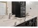 Bathroom features a white marble countertop, sleek black cabinets, and modern fixtures at 215 18Th Ave, Indian Rocks Beach, FL 33785