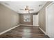Bedroom features sleek wood floors, bright windows, and a ceiling fan at 215 18Th Ave, Indian Rocks Beach, FL 33785