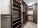 Walk-in closet with custom shelving and storage, providing ample space and organization at 215 18Th Ave, Indian Rocks Beach, FL 33785