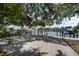 Wooden dock overlooking calm water with boats and houses in the distance at 215 18Th Ave, Indian Rocks Beach, FL 33785