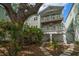 Inviting waterfront home with a covered patio, lush garden, and a cozy backyard retreat at 215 18Th Ave, Indian Rocks Beach, FL 33785