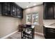 Eat-in kitchen area featuring bar seating and a cozy breakfast nook with natural light at 215 18Th Ave, Indian Rocks Beach, FL 33785