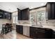 Modern kitchen featuring granite countertops, stainless steel appliances, and wood cabinets at 215 18Th Ave, Indian Rocks Beach, FL 33785