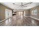 Large open-concept living room featuring hardwood floors, recessed lights and neutral decor at 215 18Th Ave, Indian Rocks Beach, FL 33785