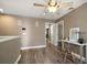 Open loft featuring wood floors, a ceiling fan, and a desk with an transparent chair at 215 18Th Ave, Indian Rocks Beach, FL 33785