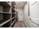 Spacious walk-in closet with ample shelving for organized storage and a water heater unit at 215 18Th Ave, Indian Rocks Beach, FL 33785