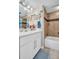 Stylish bathroom showcasing a vanity, a shower/tub combo, and coastal-themed decorations at 223 Island Way # 7F, Clearwater Beach, FL 33767