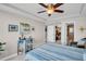 Bedroom featuring a ceiling fan, nautical accents, and doorway to a closet at 223 Island Way # 7F, Clearwater Beach, FL 33767