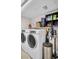 Modern laundry room equipped with a washer and dryer for added convenience at 223 Island Way # 7F, Clearwater Beach, FL 33767