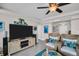 Relaxing living room showcasing a coastal design, tile flooring, and comfortable seating at 223 Island Way # 7F, Clearwater Beach, FL 33767