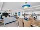 Open living space with dining area, living room, and modern kitchen that creates a bright and inviting atmosphere at 223 Island Way # 7F, Clearwater Beach, FL 33767