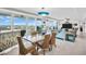 Open concept living space with access to balcony and amazing panoramic views from the floor to ceiling windows at 223 Island Way # 7F, Clearwater Beach, FL 33767
