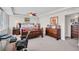 Spacious bedroom featuring a decorative bed frame, dual nightstands, dresser, and a ceiling fan at 223 Island Way # 7F, Clearwater Beach, FL 33767