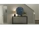 Stylish entryway featuring modern decor, lighting, mirror and nearby stairs at 2273 Blue Grosbeak Pl, Wimauma, FL 33598