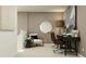 Inviting home office nook featuring a cozy chair, workspace, and stylish decor at 2273 Blue Grosbeak Pl, Wimauma, FL 33598