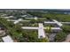 An aerial view of this apartment complex provides a bird's eye view of its unique architecture and community setting at 2441 Persian Dr # 61, Clearwater, FL 33763