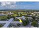 An aerial view of the property showcases its location near the golf course and pond at 2441 Persian Dr # 61, Clearwater, FL 33763