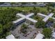 An aerial view of the apartment complex, showcasing the surrounding lush greenery and beautiful golf course at 2441 Persian Dr # 61, Clearwater, FL 33763