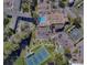 An aerial view showing the layout of the property including pool, tennis, and shuffleboard at 2441 Persian Dr # 61, Clearwater, FL 33763