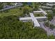 An aerial view of the apartment complex, showcasing the surrounding lush greenery and beautiful golf course at 2441 Persian Dr # 61, Clearwater, FL 33763