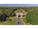 Aerial view of the community entrance archway and landscaped grounds of the property at 2441 Persian Dr # 61, Clearwater, FL 33763