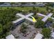 Aerial shot with arrow highlighting one of the apartments in a well-maintained building near a golf course at 2441 Persian Dr # 61, Clearwater, FL 33763