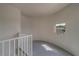 Curved balcony with white railings and a view of the complex at 2441 Persian Dr # 61, Clearwater, FL 33763