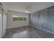 Inviting bedroom with natural light, ceiling fan, and plenty of closet space at 2441 Persian Dr # 61, Clearwater, FL 33763
